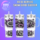 3D-rendered image of a 40 oz acrylic snow globe guzzler with floral and butterfly design on a purple background.