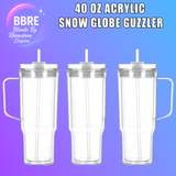 3 clear acrylic tumblers with handles and straws on a purple background, branded 'BBRE Blanks By Rhinestone Empire'.