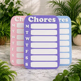 Three chore charts in pink, purple, and blue on a marble surface with plants in the background.