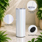 White tumbler with straw and lid on a neutral background with plants