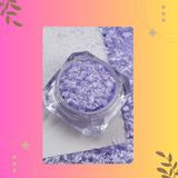 Purple glitter in a hexagonal container on a colorful background
