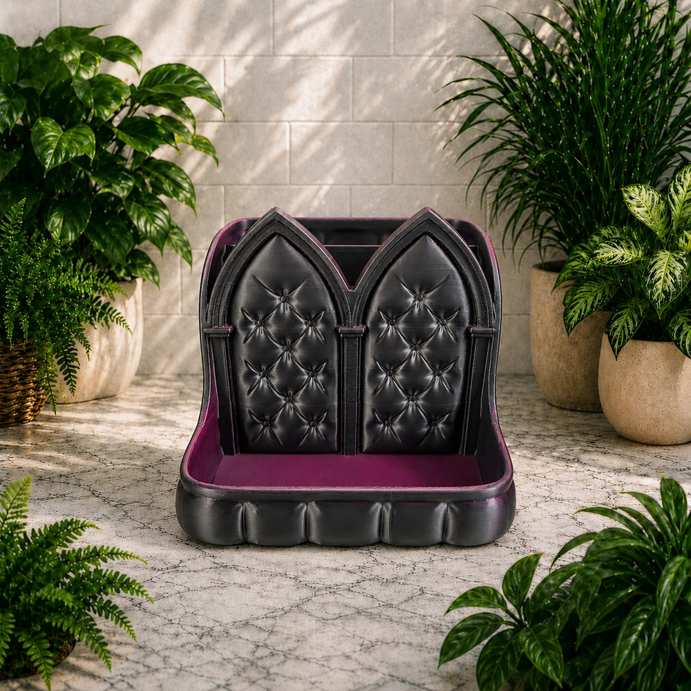 Black and purple caddy with tufted design in a room with plants