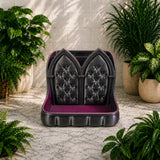 Black and purple caddy with tufted design in a room with plants