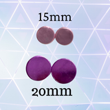 Purple circular objects with labeled sizes on a geometric patterned background