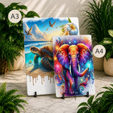 Two decorative panels with artistic designs of an elephant and a turtle on a marble surface with plants around.