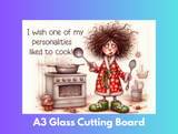 Cartoon character in a kitchen with text 'I wish one of my personalities liked to cook!' and 'A3 Glass Cutting Board' text at the bottom.