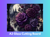 Decorative glass cutting board with purple roses and a castle design on a gradient background.