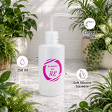 White squeeze bottle with labeled features on a light wooden surface with plants in the background