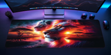 Gaming desk setup with a large mouse pad featuring lion artwork.