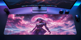 Desk setup with a large mouse pad featuring an artistic design of a woman in a fantasy setting, placed in front of a computer monitor.