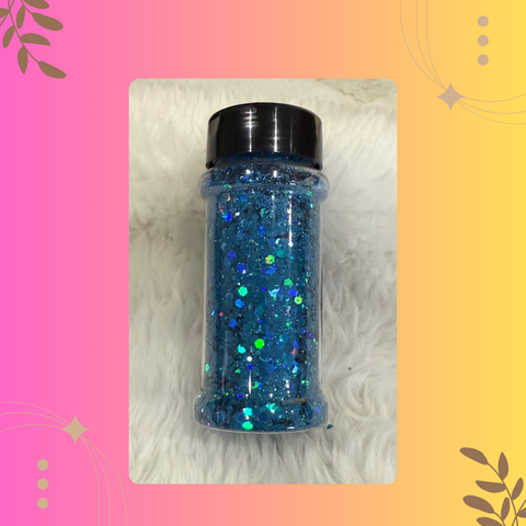 Jar of blue glitter on a textured surface with a colorful border