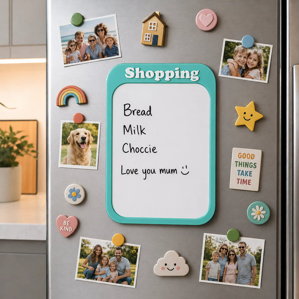 Fridge with a whiteboard magnet listing groceries and decorative magnets.