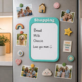 Fridge with a whiteboard magnet listing groceries and decorative magnets.