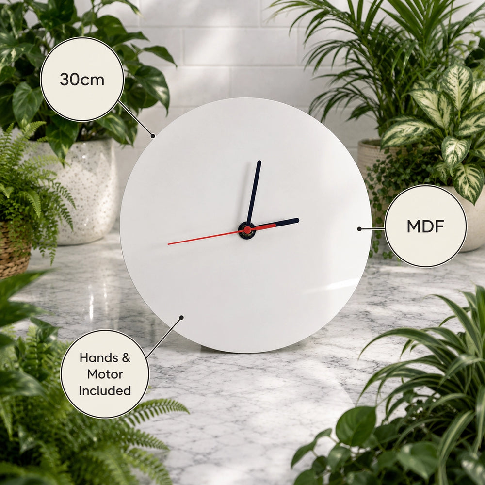 White wall clock with plant decorations on a marble surface