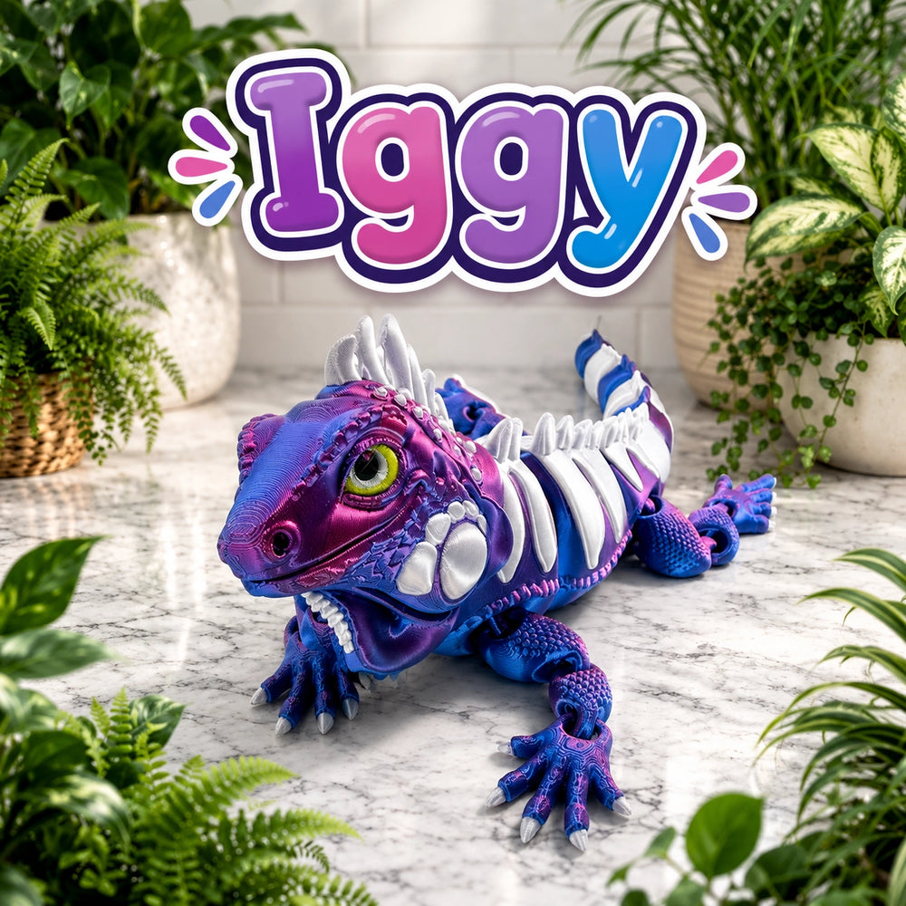 A colorful purple and blue iguana toy with white skeletal details, displayed on a marble surface surrounded by potted green plants, with a large 'Iggy' logo overlay at the top.