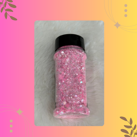 Pink glitter jar with black lid on a colorful background