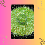 Green glittery ring on a colorful gradient background