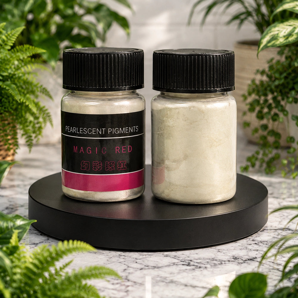 Two jars of pearlescent pigments on a black stand with plants in the background