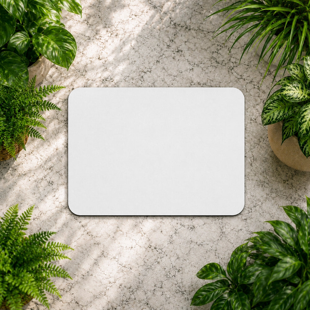 White rectangular object on a textured surface with plants around