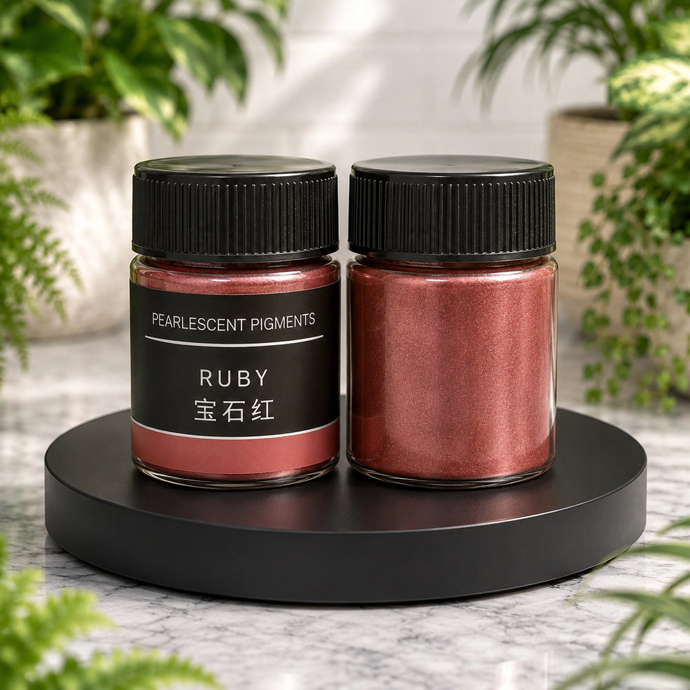 Two jars of pearlcent pigments labeled 'Ruby' on a black stand with plants in the background.