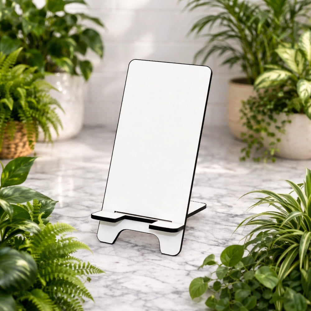 Phone stand on a marble surface with plants around